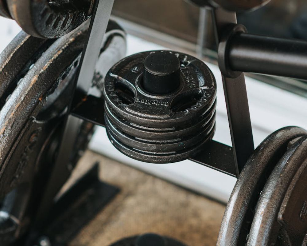 Detailed view of gym weights and a water bottle.
