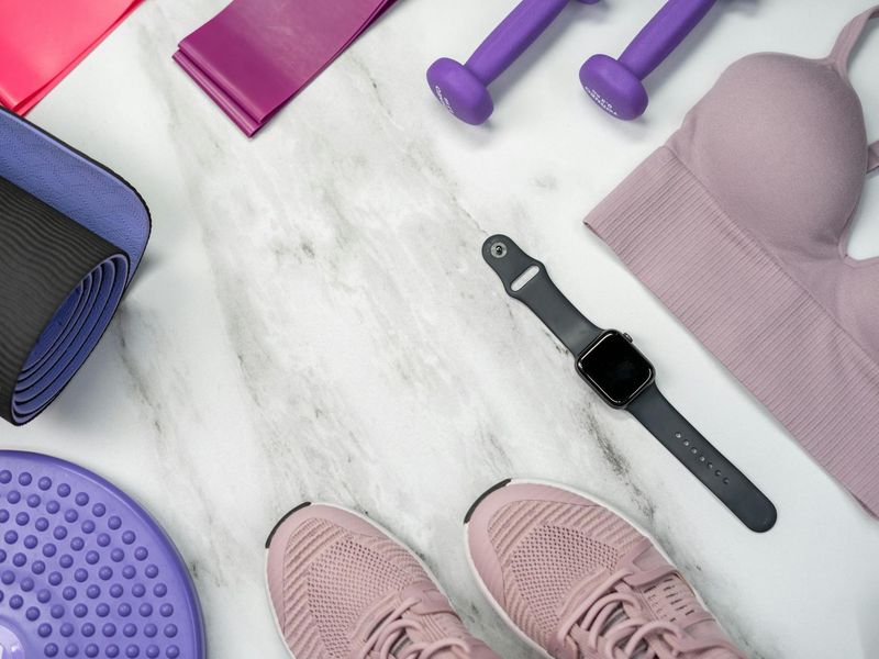 Minimalist training space with a yoga mat and weights.